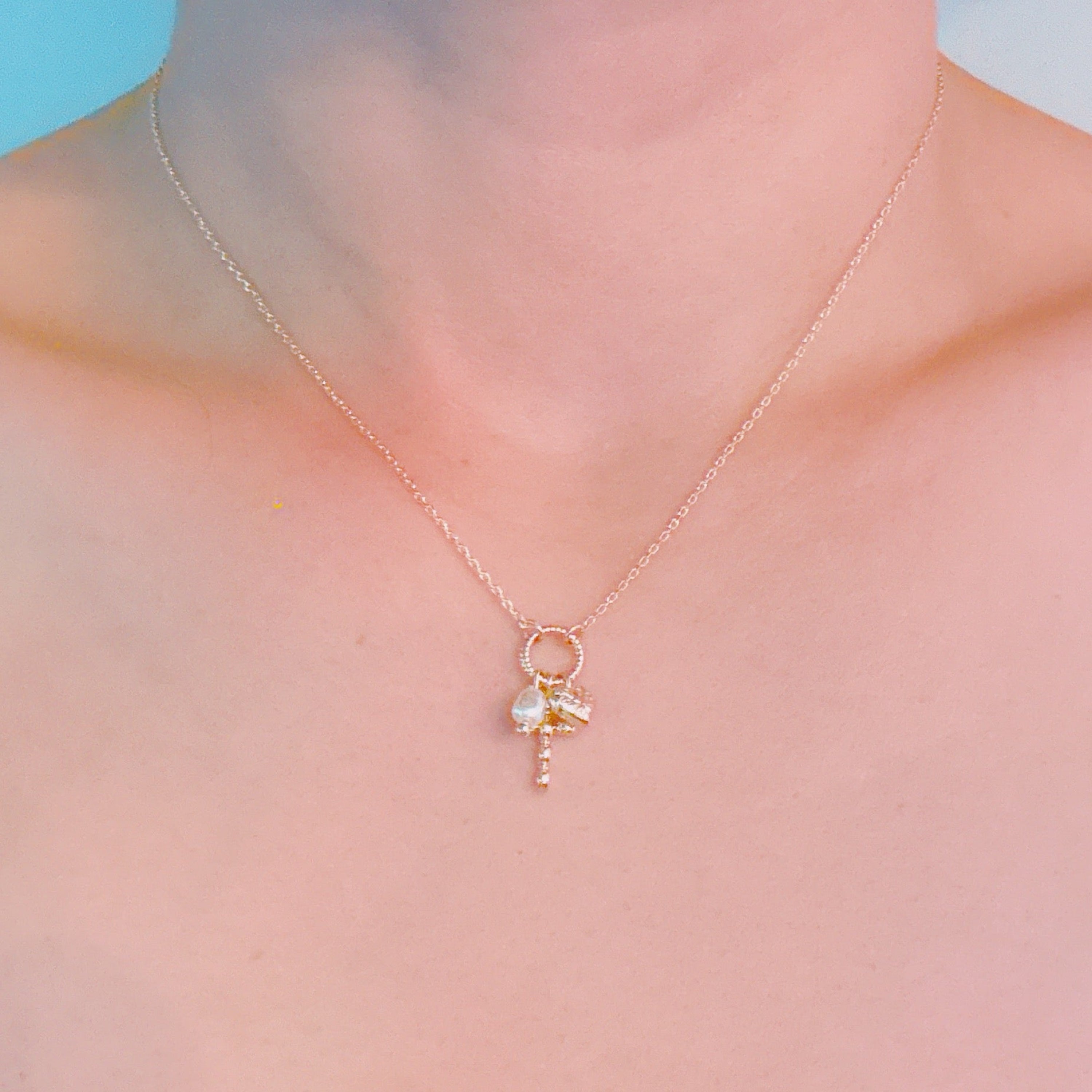 Faith & Love Charm Necklace – Gold-Tone Chain with Heart, Cross, and Pearl Charms